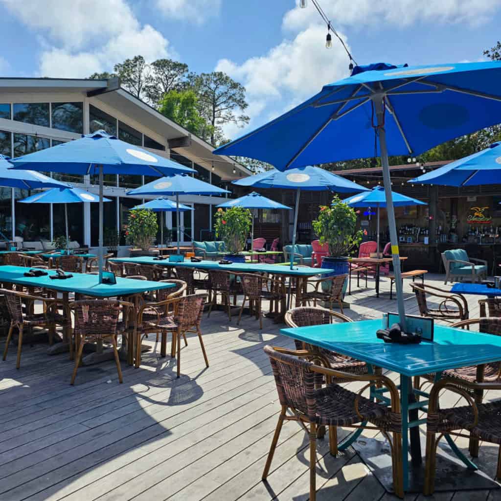 Outdoor dining tables on the deck of GTs on the Bay Restaurant