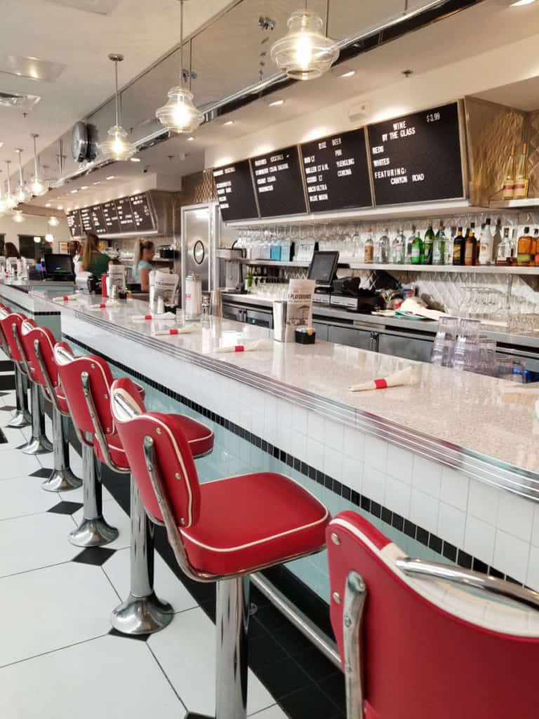 Counter seating with waitress and menus in the baclground