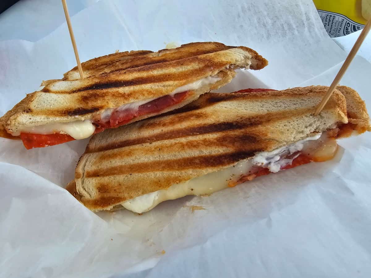 Pepperoni Grilled Cheese panini on a paper lined basket