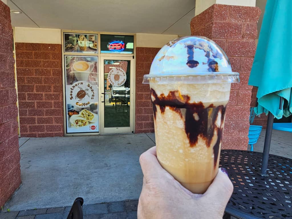 Bushwacker Frappe being held outside of Southern Shores Coffee