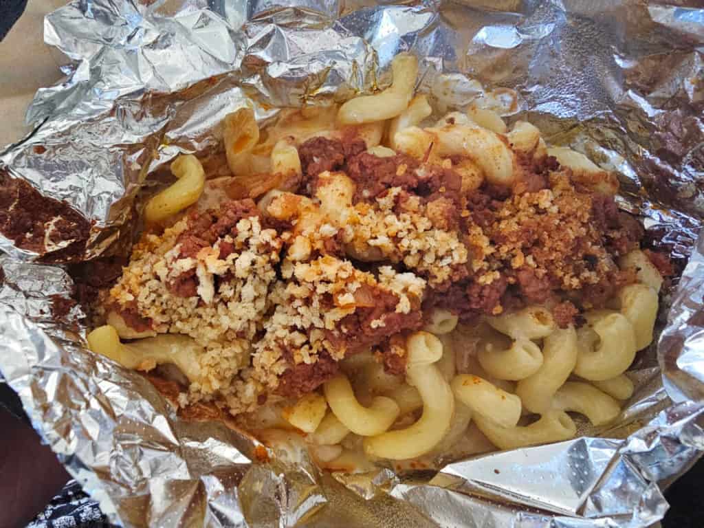 Chili mac and cheese wrapped in aluminum foil from Island Wing Company