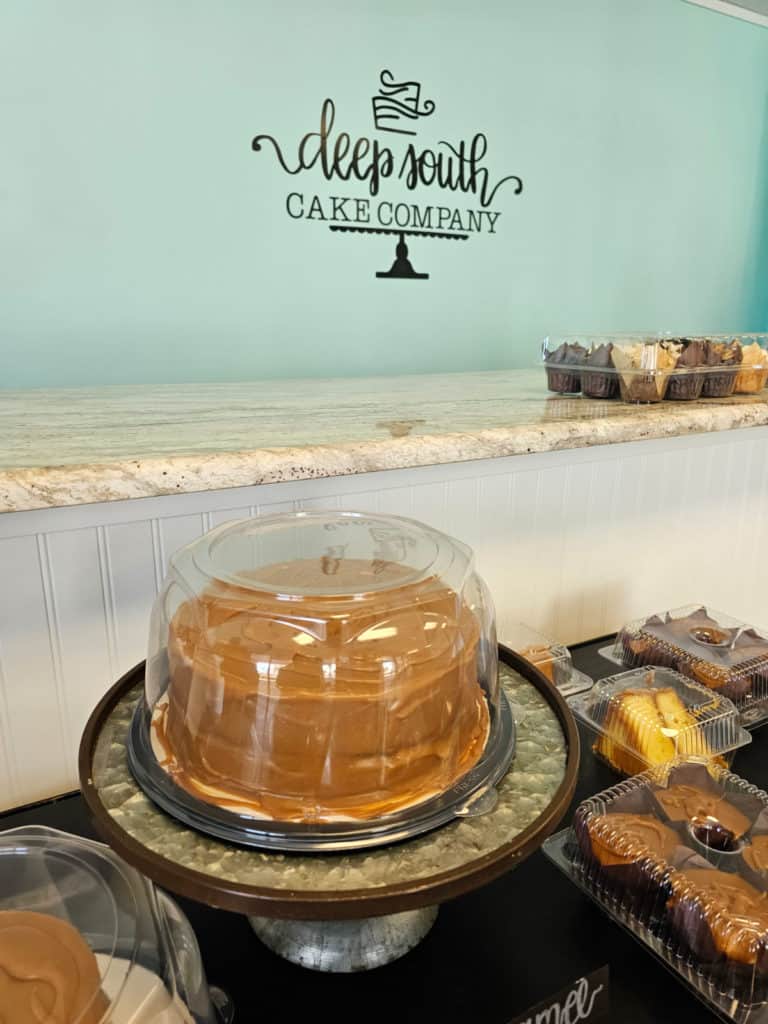 Deep South Cake Company logo above a caramel cake