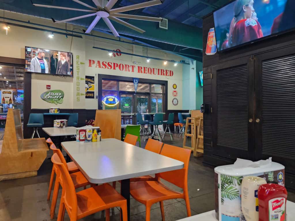 indoor seating area with tables and chairs at Island Wing Company Gulf Shores