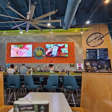 Island Wing Company bar and tables with tvs in the background