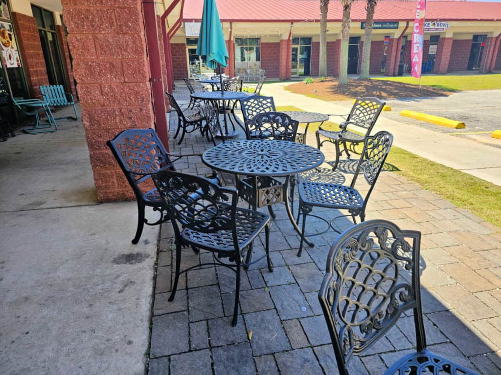 metal tables and chairs outside of LIckin Good Donuts, Gulf Shores Al 