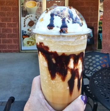 Bushwacker Frappe with chocolate on the glass in front of Southern Shores Coffee