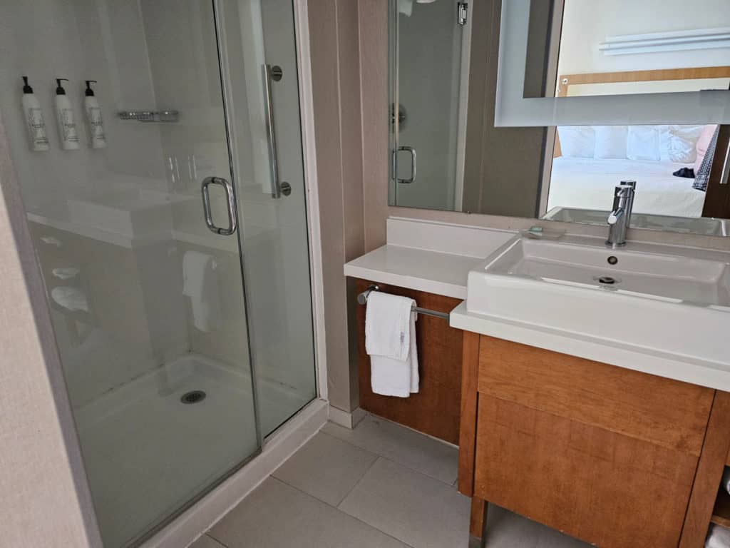 Walk in shower and bathroom counter in the Springhill Suites Orange Beach