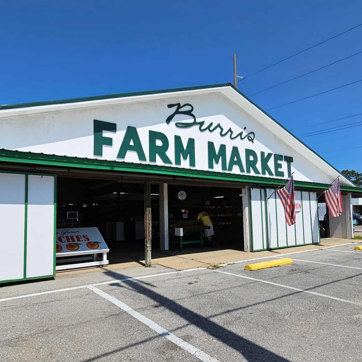 Burris Farm Market entrance with white and green building
