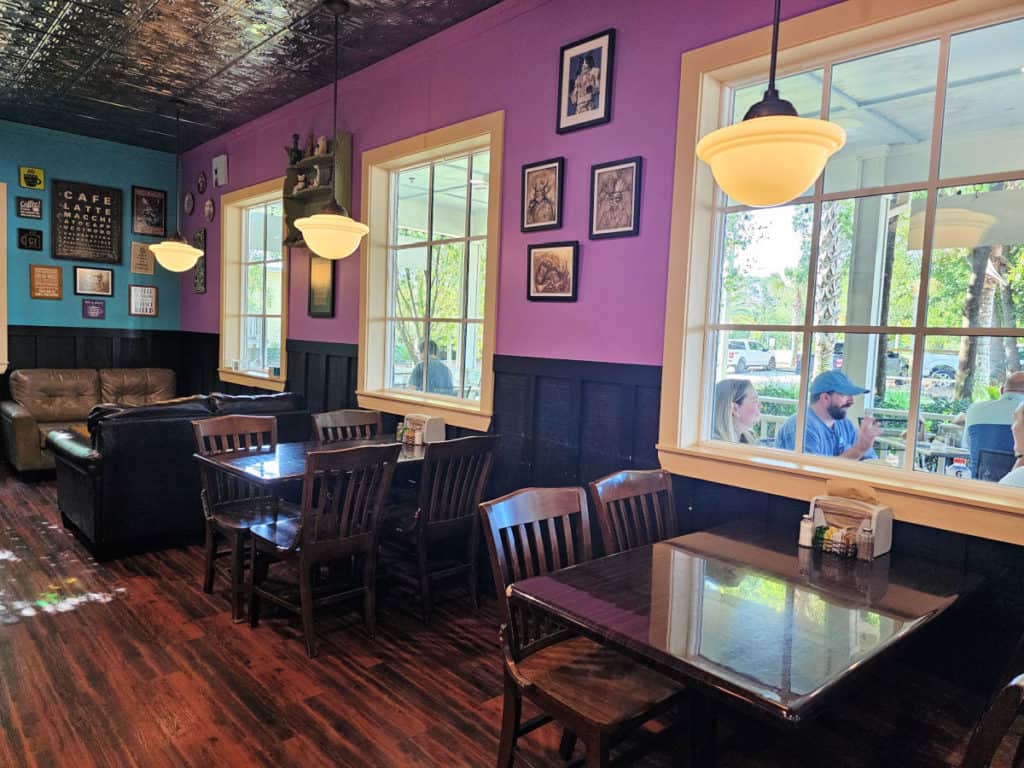 indoor seating with tables and chairs, couches and more in BuzzCatz Coffee and Sweets