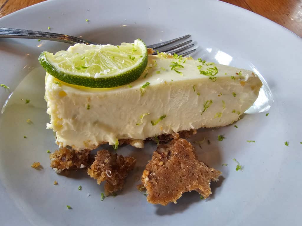 Key Lime Pie on a white plate at Locals Fairhope