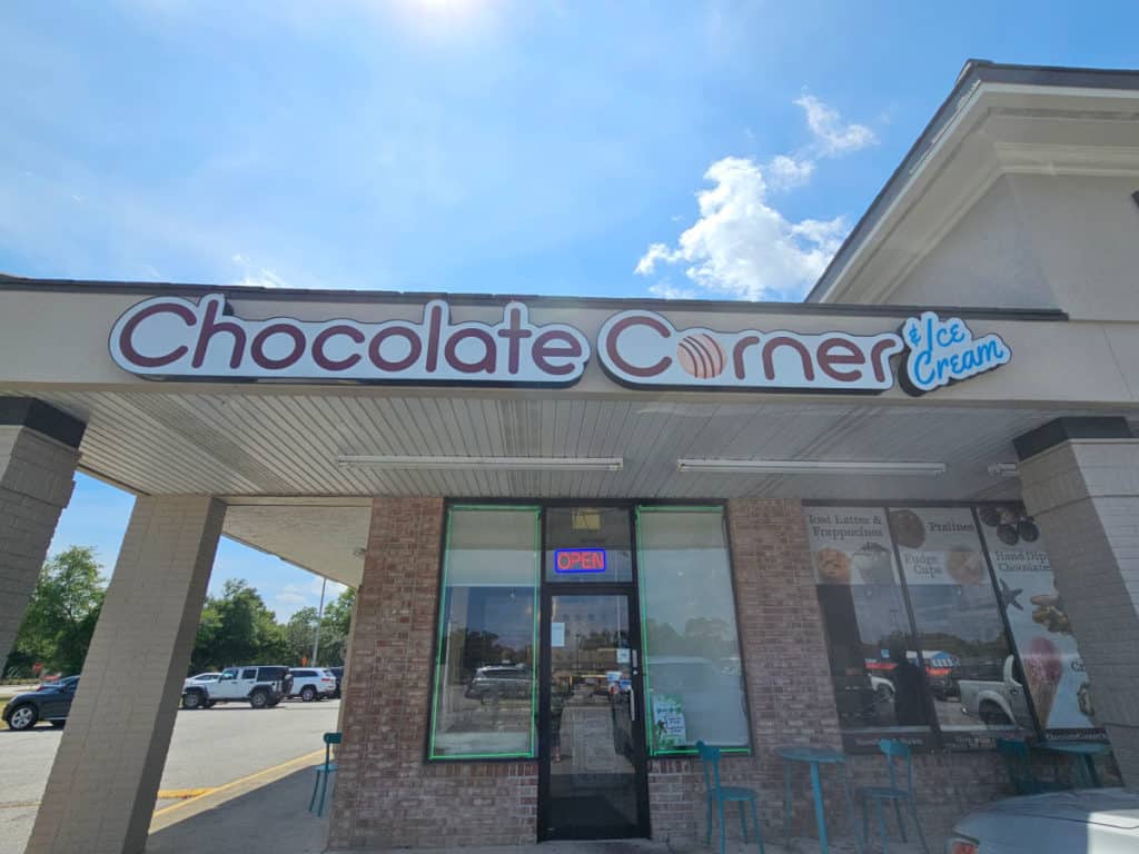 Exterior entrance of Chocolate Corner and Ice Cream with open sign