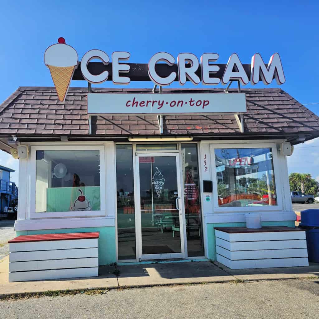 Cherry on Top Ice Cream sign with entrance to the store