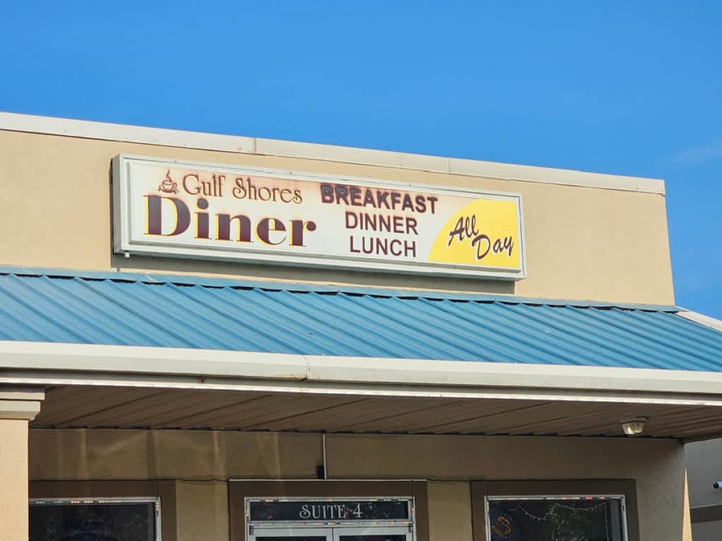 Gulf Shores Diner entrance sign with breakfast, dinner and lunch all day