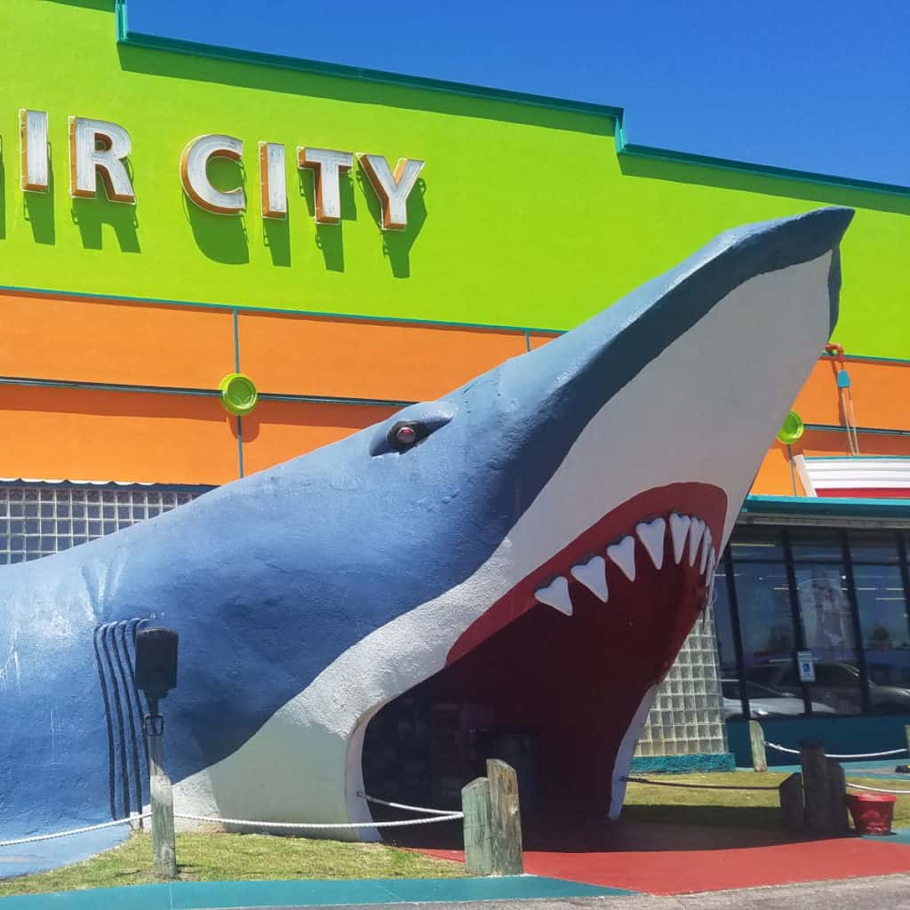 large shark mouth walkway into a lime green Souvenir City Gulf Shores