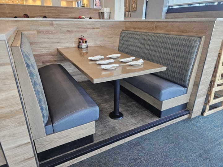 Booth with bench seats and table with place settings