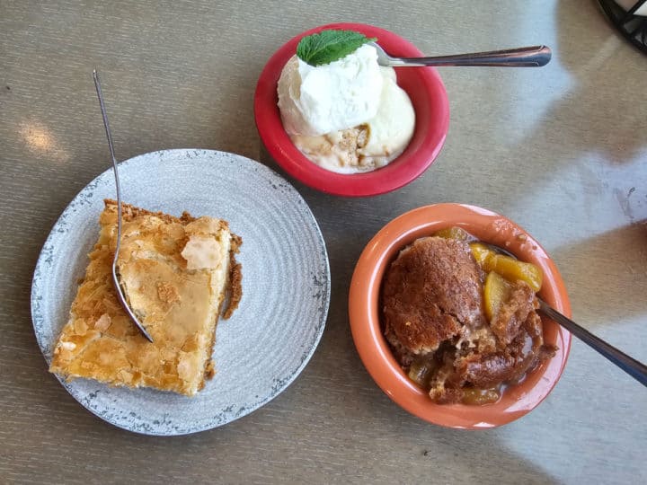 Ooey Gooey Butter Cake, Banana Pudding, and Peach Cobbler dessert servings