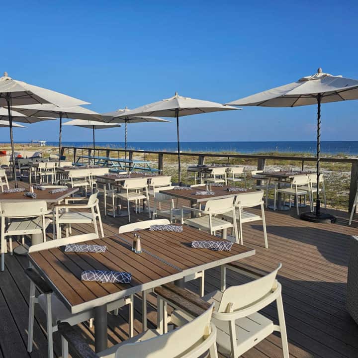 outdoor seating at Foodcraft at Gulf State Park Lodge with views of the water