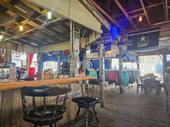 gift shop with t-shirts and bar seating in the Flora Bama Yacht Club