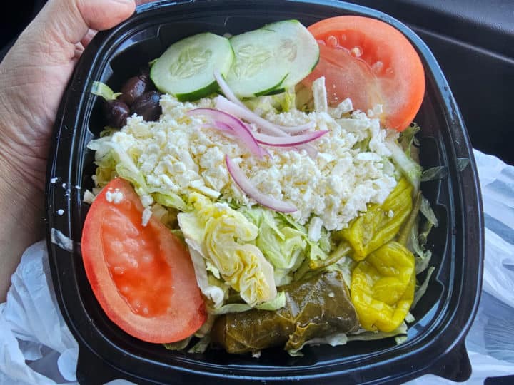 Greek salad in a plastic container 