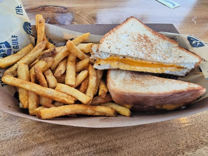Grilled cheese and Fries wrapped in The Gulf paper