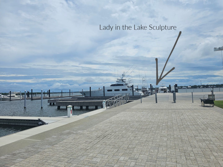 How to see the Lady in the Lake Alabama with an arrow on the photo showing the sculpture