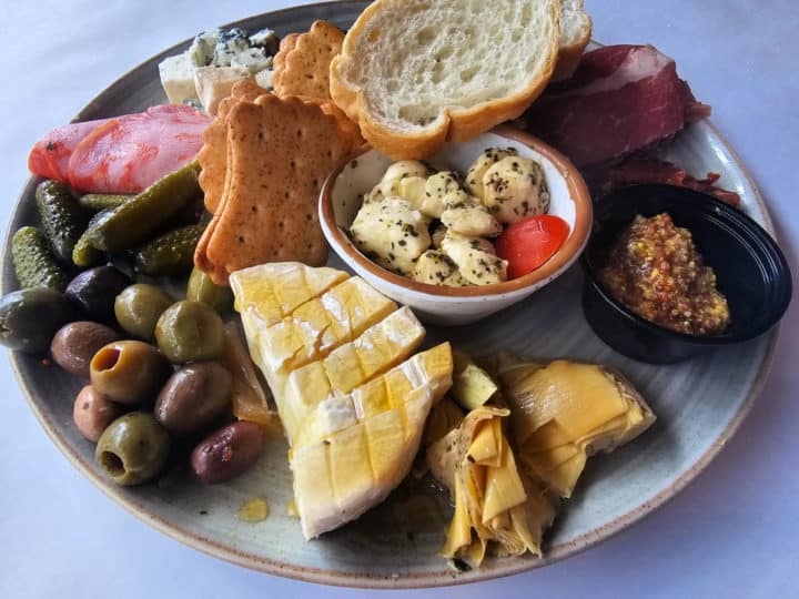 Italian Cheese and meat board on a white plate