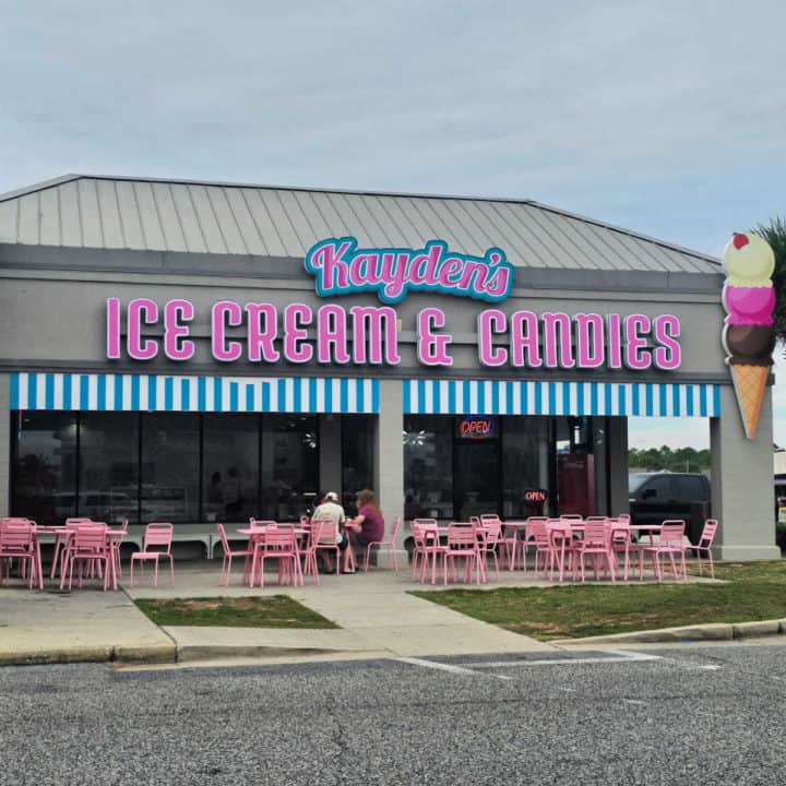 Kayden's Ice Cream and Candies exterior with pink tables and chairs