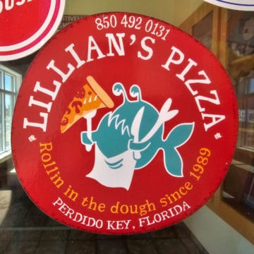 Lillian's Pizza sticker with fish holding a slice of pizza and a knife