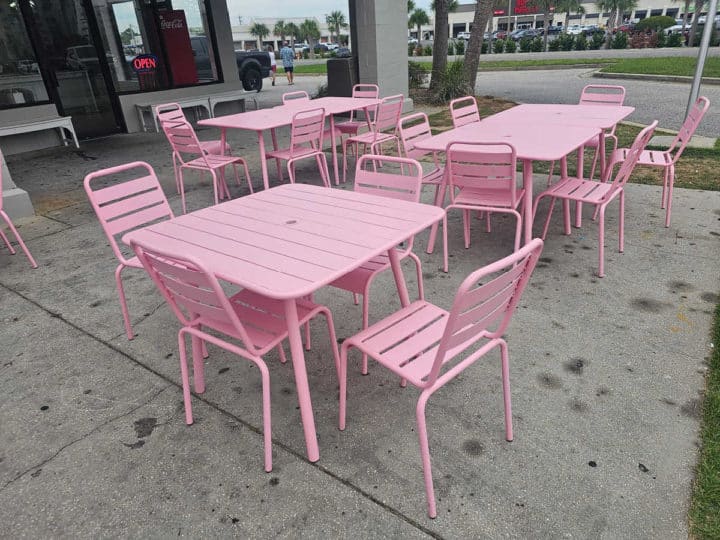 Pink tables and chairs outside of Kaydens