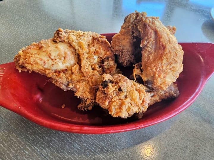 Fried chicken stacked in a red bowl