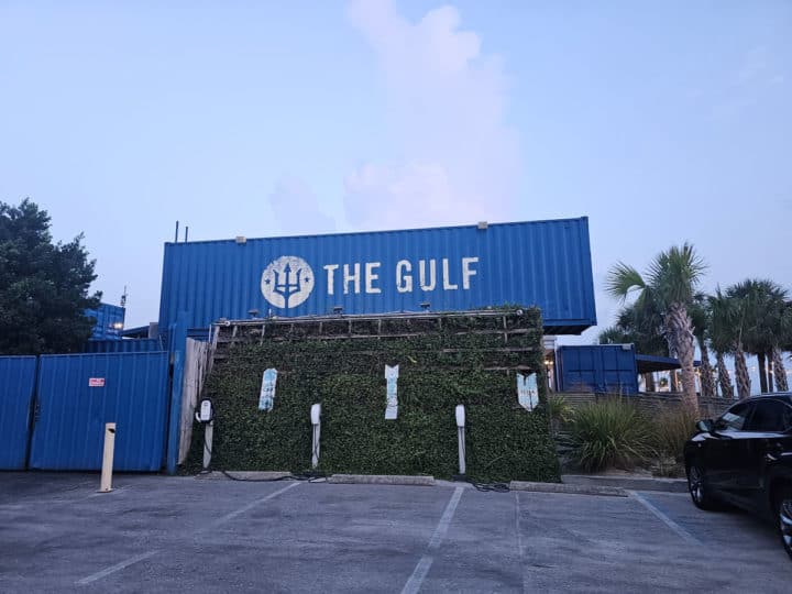 The Gulf container restaurant with palm trees