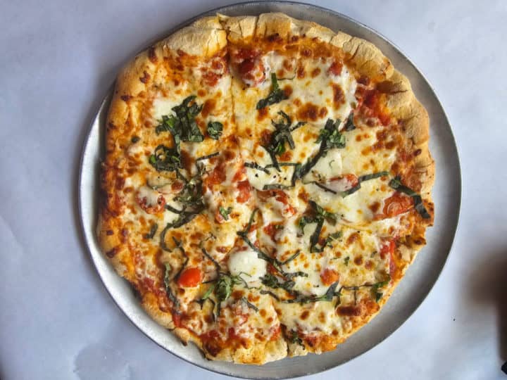 Margherita pizza on a pizza pan