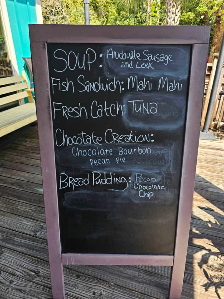 Daily specials board with soup, fish sandwich, fresh catch, chocolate creation, and bread pudding options
