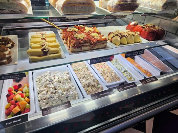 pasta and salads displayed in a refrigerator case