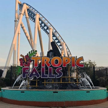Tropic Falls sign with roller coaster in the background