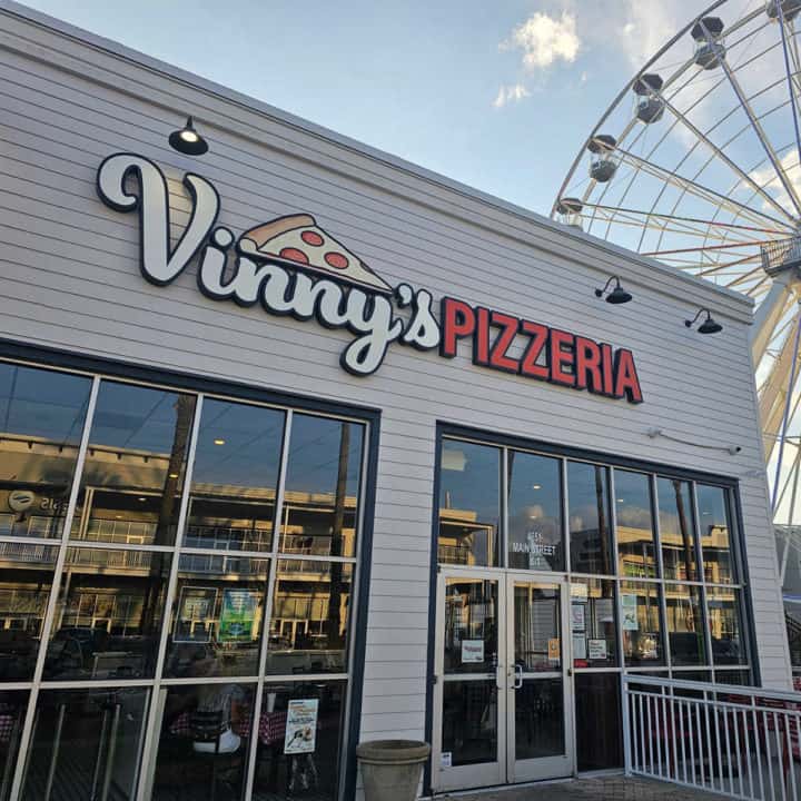 Vinny's Pizzeria entrance with the Wharf Ferris Wheel in the background