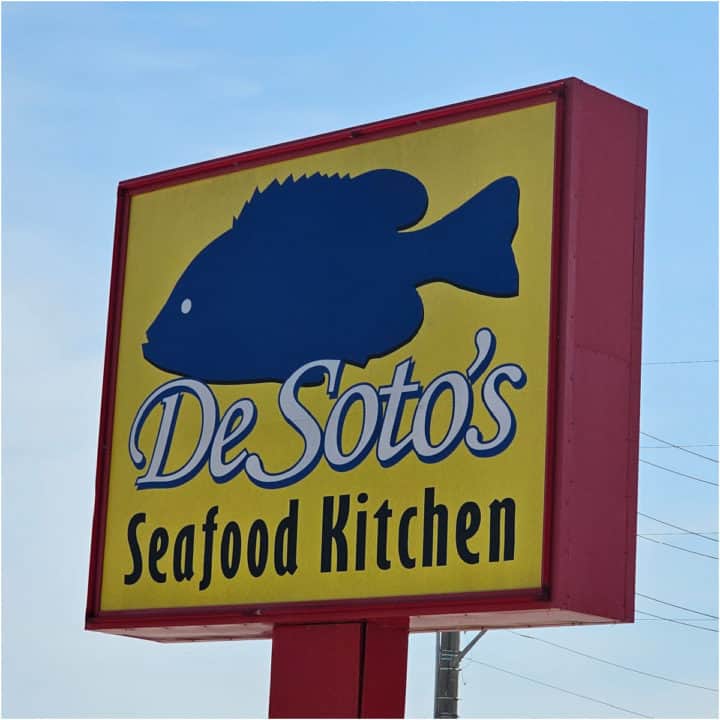 Blue Fish over De Soto's Seafood Kitchen on a large sign