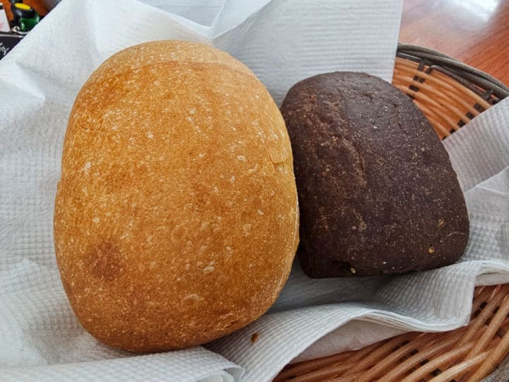 Two loafs of fresh bread in a basket