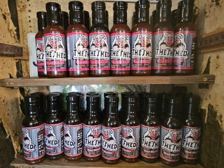 The Shed Barbecue sauce lined up on shelves