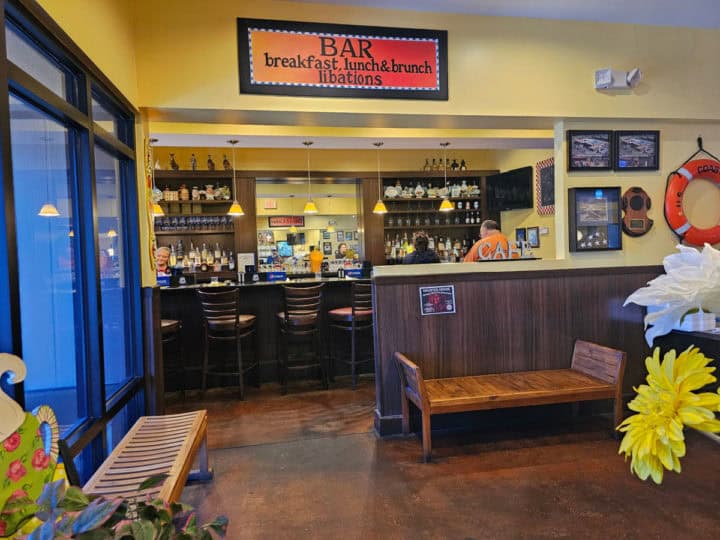 indoor bar with bar seating and signage