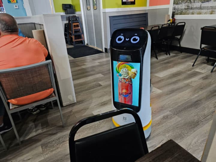 robot with a photo of a Cat 5 Milkshake on the front of it