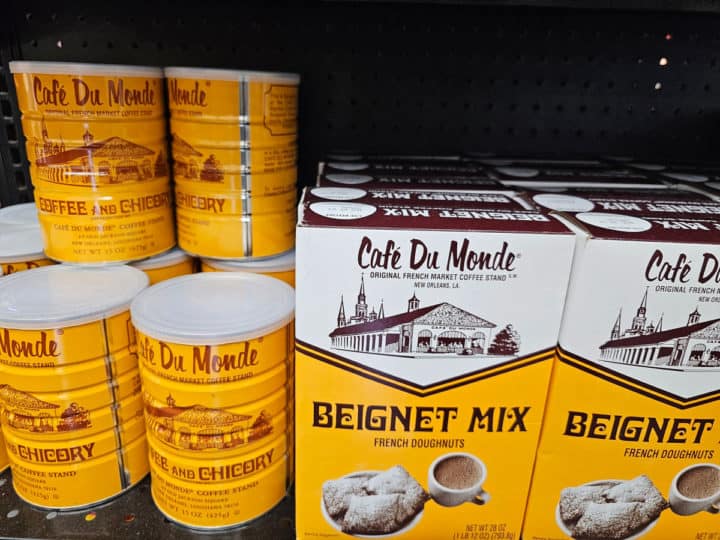 Café du Monde Beignet Mix and Chicory Coffee can on a shelf