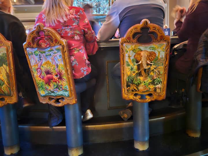 carousel seats with a painted monkey and elephant 