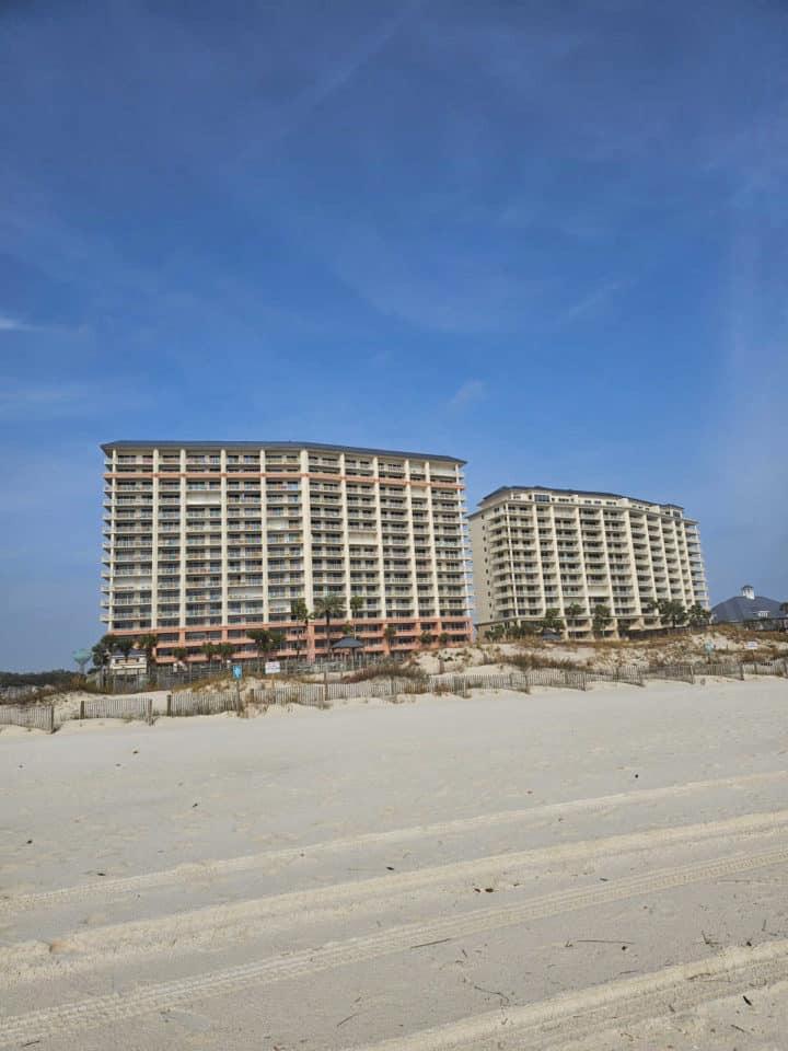 Looking up the beach to two condo towers