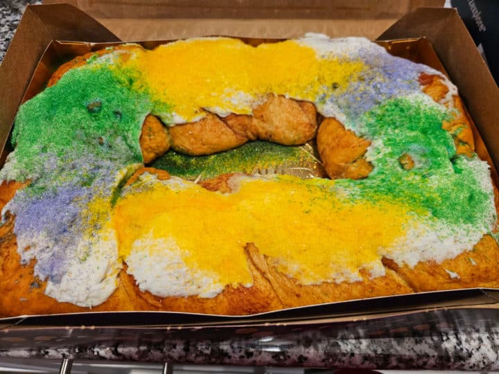 king cake in a box with sprinkles on top