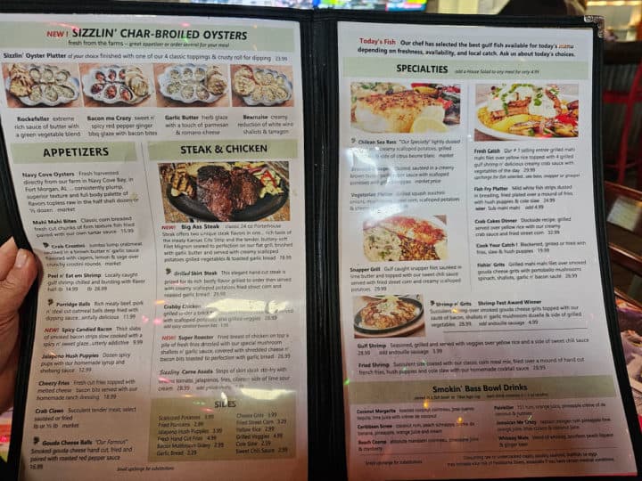 two page menu being held by a hand