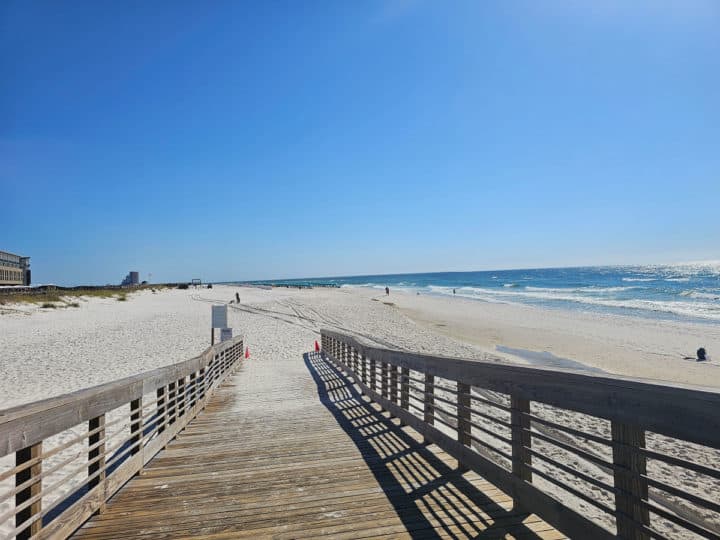 wooden walkway down to a sandy beach and the Gulf of Mexico