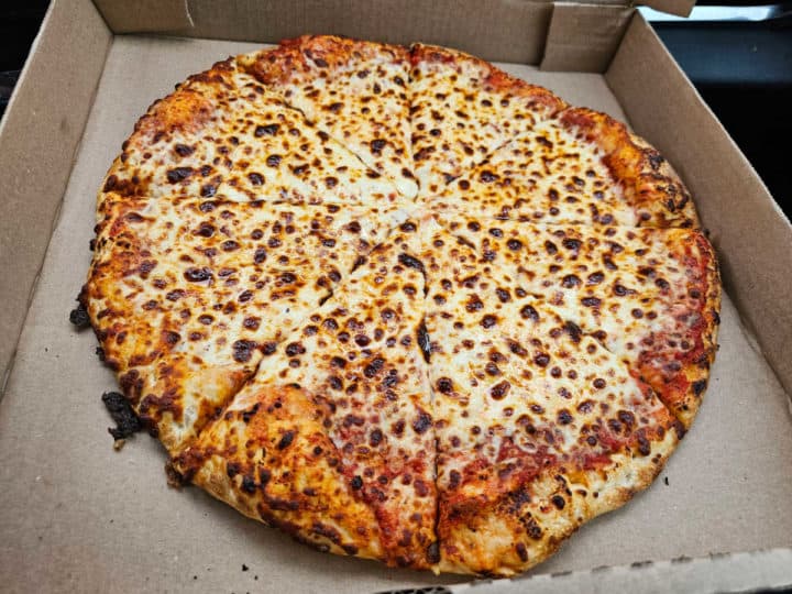 cheese pizza in a cardboard pizza box