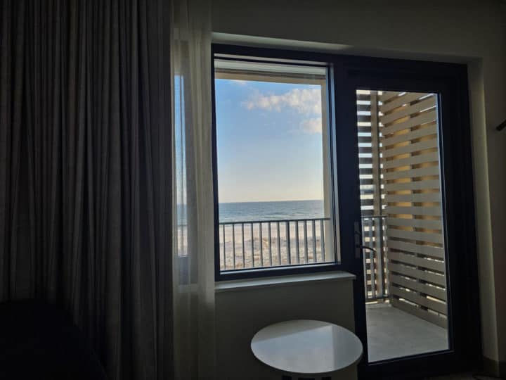 Looking through a window to a balcony and Gulf of Mexico