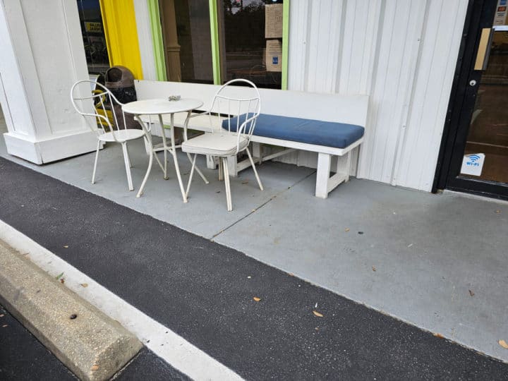 outdoor seating with white chairs 